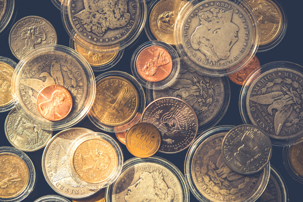 Mixed collection of rare U.S. gold and silver coins in protective cases – Coin Buyers in Lubbock for collectors.